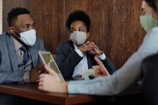 business-people-wearing-face-masks-and-talking-4427957