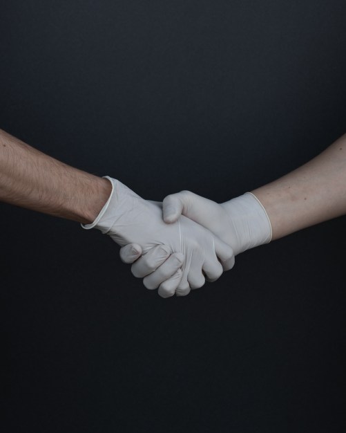 people-shaking-hands-in-latex-gloves-3959482